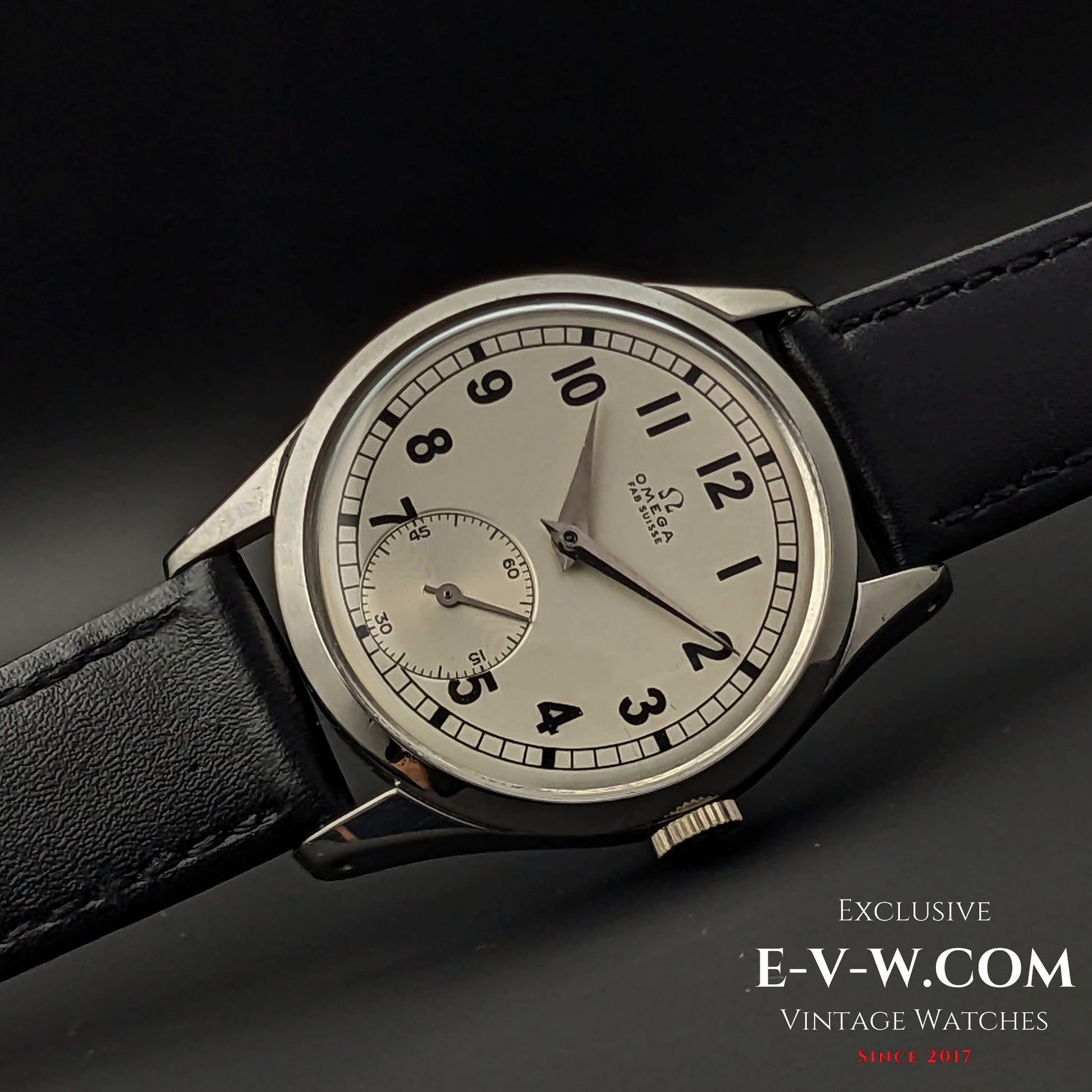 Side view of the Omega FAB SUISSE Ref. 2750-6 vintage wristwatch, showcasing its polished stainless steel case and elegant design.