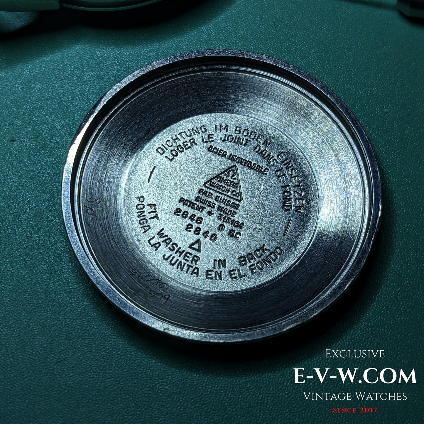 Inside case back of Vintage 1958 Omega Seamaster Automatic Watch with reference 2846 9SC and multilingual gasket instructions.