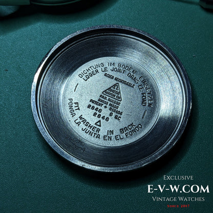 Inside case back of Vintage 1958 Omega Seamaster Automatic Watch with reference 2846 9SC and multilingual gasket instructions.