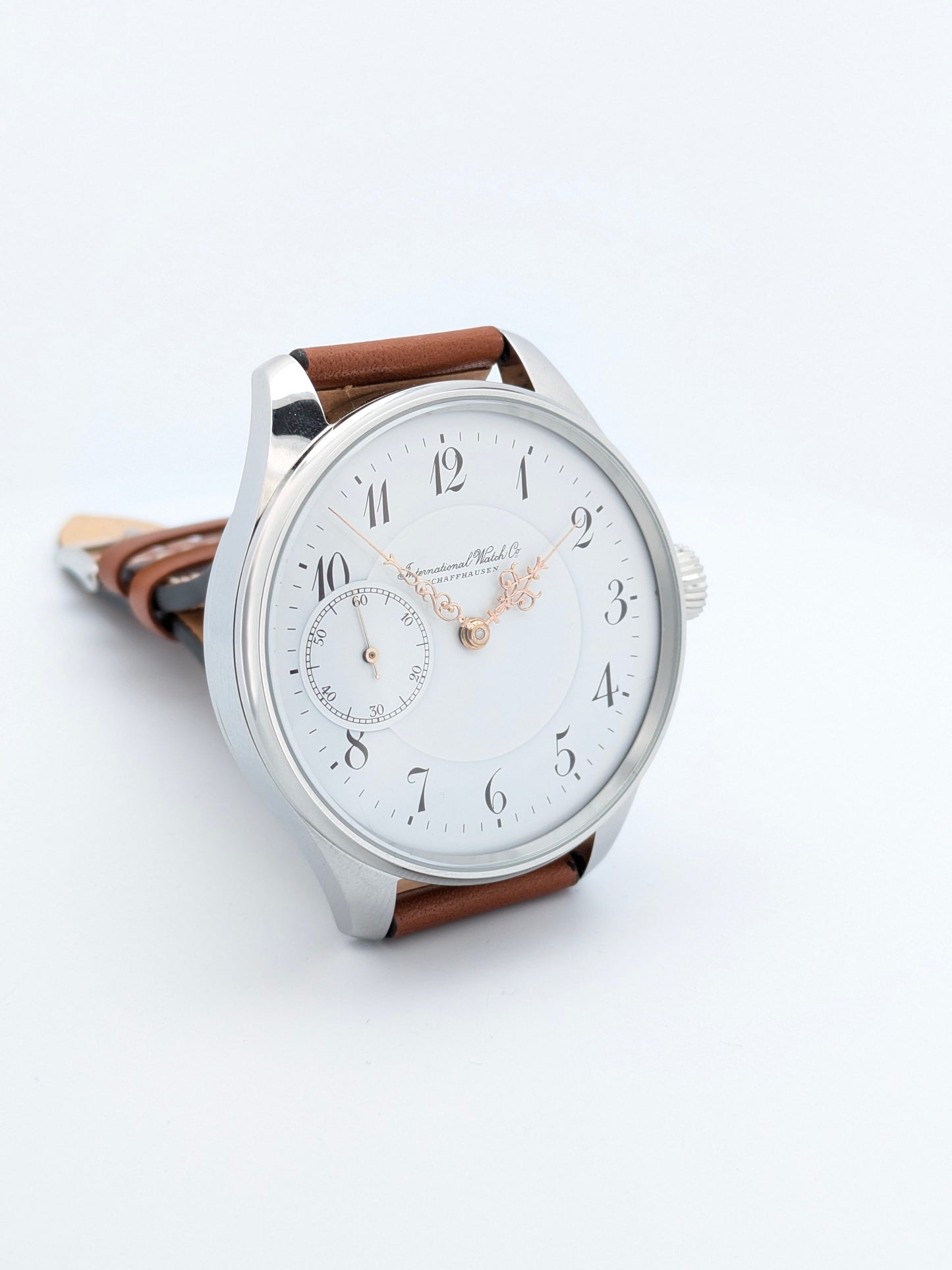 IWC Schaffhausen pocket watch conversion 1907 Watch with a brown leather strap on a white background