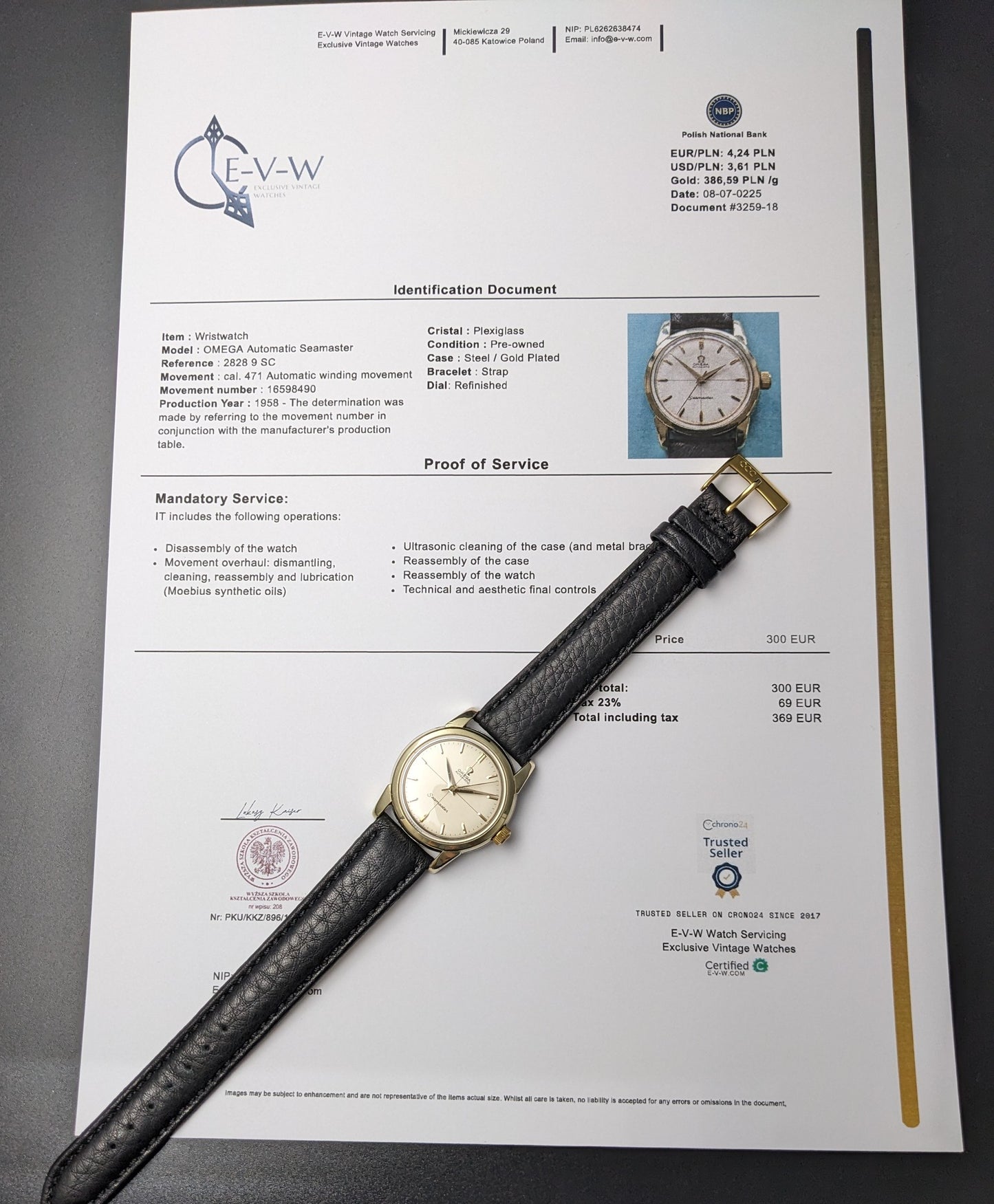 1958 Omega Seamaster Ref. 2828-9SC Cal. 471 vintage watch with service certificate and black leather strap laid on official documentation.