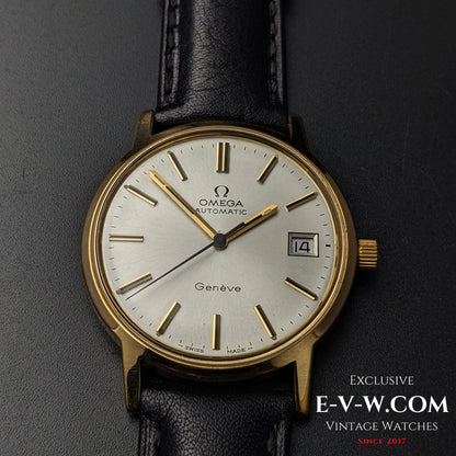 Front view of Omega Geneve 1973 Watch Ref. 1660163 with gold case, silver dial, and date window, paired with black leather strap.