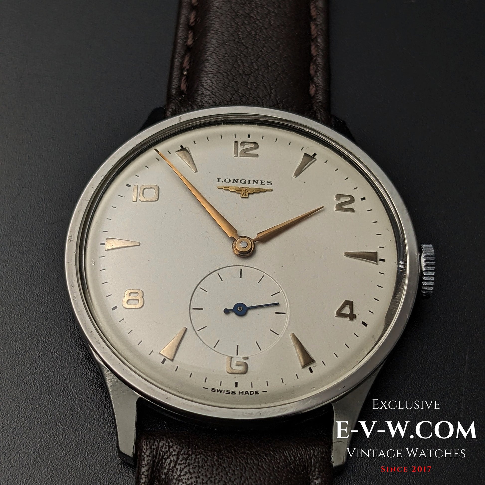 Front view of 1955 Longines Jumbo Calatrava Ref 2849 showcasing silver dial with Arabic numerals and sub-seconds at 6 o'clock.