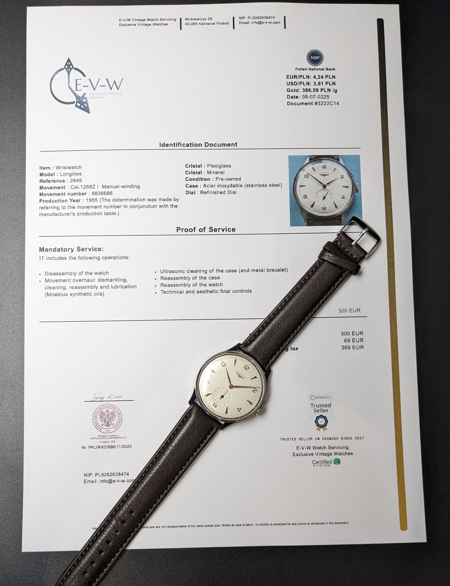 1955 Longines Jumbo Calatrava Ref 2849 watch displayed with official identification and service document, highlighting authenticity and condition.