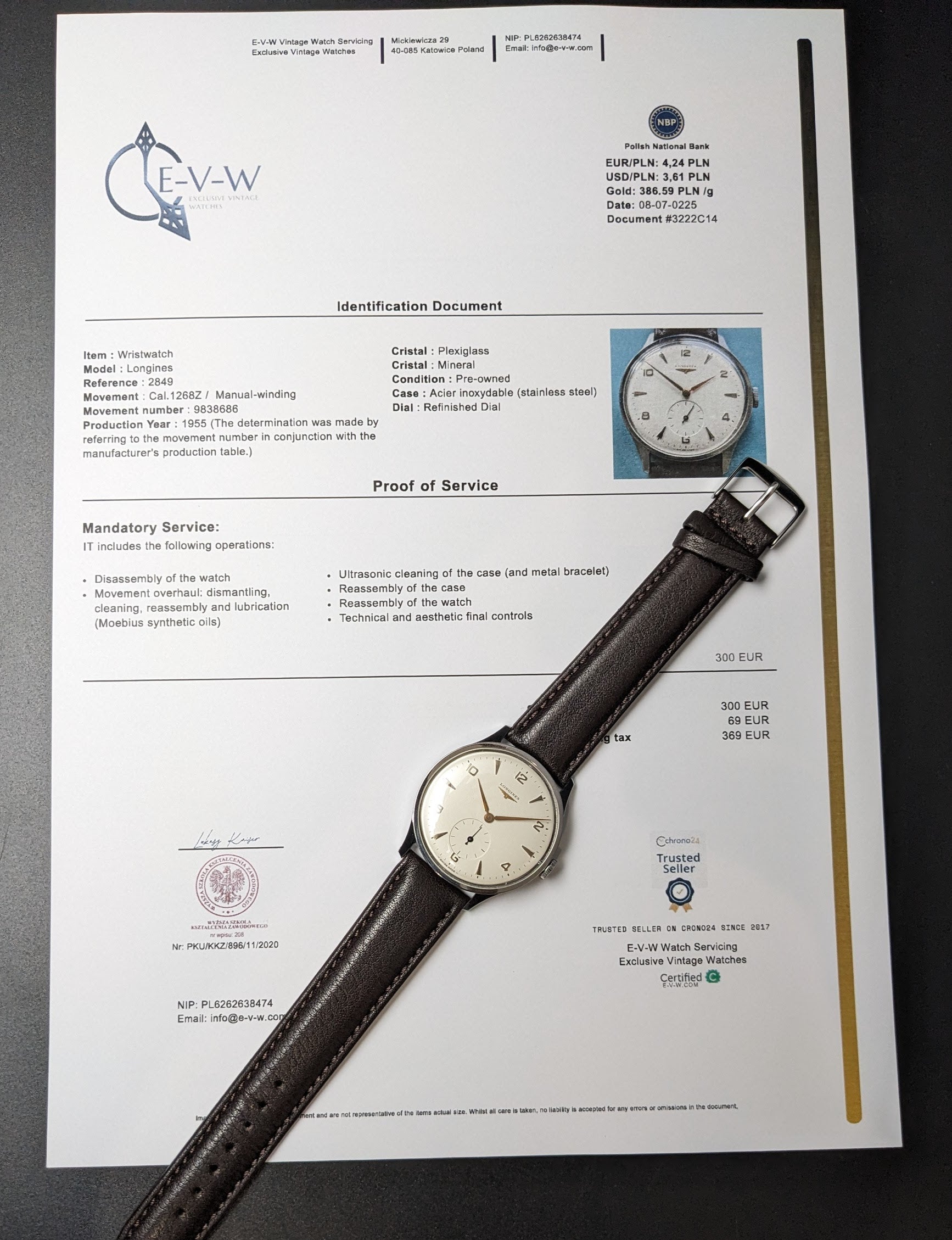 1955 Longines Jumbo Calatrava Ref 2849 watch displayed with official identification and service document, highlighting authenticity and condition.