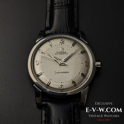 Front view of Vintage 1958 Omega Seamaster Automatic Watch with silver dial, luminous markers, and black leather strap.